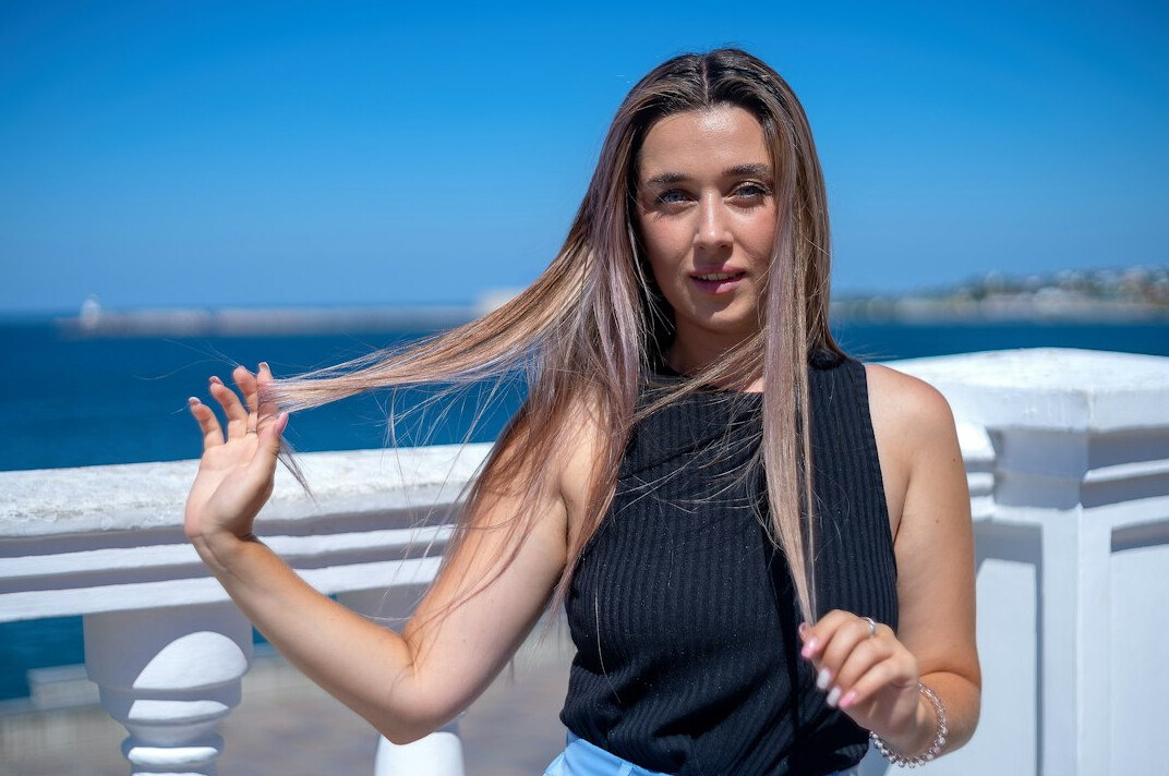 Portrait of a friendly young woman with long hair