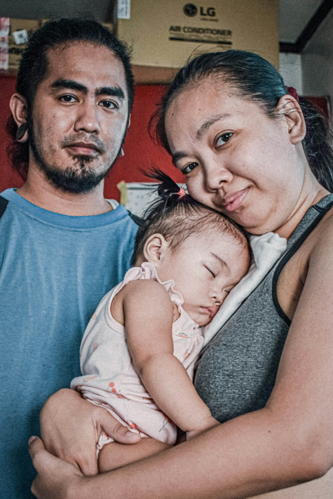 young parents with newborn baby